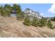 Charming two-story home with multiple balconies and a gazebo perched atop a scenic slope at 426 Buena Vista Rd, Golden, CO 80401