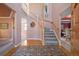 Grand foyer with a staircase, high ceilings, hardwood floors, and an elegant rug at 426 Buena Vista Rd, Golden, CO 80401