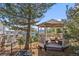 Gazebo sitting area with views of the mountains featuring seating and a hammock for lounging at 426 Buena Vista Rd, Golden, CO 80401