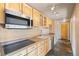 Modern kitchen featuring stainless appliances, bright cabinetry, and lots of counter space at 426 Buena Vista Rd, Golden, CO 80401