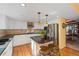 Well-lit kitchen with an island, stainless steel appliances, and seamless transition to the dining area at 426 Buena Vista Rd, Golden, CO 80401