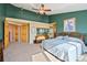 Inviting primary bedroom with a ceiling fan, ensuite bath, and ample closet space at 426 Buena Vista Rd, Golden, CO 80401