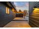 Spacious outdoor patio with a canvas shade, ideal for entertaining and enjoying outdoor living with stylish lighting at 8120 W 54Th Pl, Arvada, CO 80002