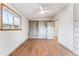 Spacious bedroom featuring wood floors, a ceiling fan, and a window for natural light at 8120 W 54Th Pl, Arvada, CO 80002