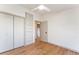 Bedroom featuring wood floors, closet and door to the bathroom at 8120 W 54Th Pl, Arvada, CO 80002