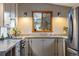 Bright kitchen with stainless steel appliances, natural wood accents, and a view of the outdoors at 8120 W 54Th Pl, Arvada, CO 80002