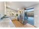 Spacious kitchen featuring stainless steel appliances and access to an outdoor patio at 8120 W 54Th Pl, Arvada, CO 80002
