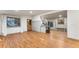 An open-concept living space with hardwood floors, a kitchen bar, and plenty of natural light, perfect for gatherings at 8120 W 54Th Pl, Arvada, CO 80002