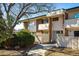 Traditional multi-story townhome featuring brick accents, white trim, and private balcony at 5120 Williams Fork Trl # 214, Boulder, CO 80301