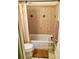 The bathroom with a tiled shower-bath, complete with towel rack and storage, providing a relaxing bathing space at 9240 E Girard Ave # 1, Denver, CO 80231