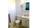 Bright bathroom featuring a toilet, vanity with sink, and wall-mounted hair dryer at 9240 E Girard Ave # 1, Denver, CO 80231