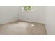 Bright, carpeted bedroom with neutral walls and a large window for natural light at 9240 E Girard Ave # 1, Denver, CO 80231