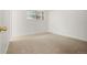 Bright, carpeted bedroom with neutral walls and a large window for natural light at 9240 E Girard Ave # 1, Denver, CO 80231