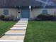 View of the Hampden Court Clubhouse featuring double doors, a manicured lawn and a concrete stairway at 9240 E Girard Ave # 1, Denver, CO 80231