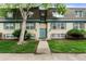 Inviting exterior with a well-manicured lawn, beautiful trees, and charming curb appeal at 9240 E Girard Ave # 1, Denver, CO 80231
