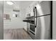 Galley kitchen features stainless steel appliances, modern countertops and ample cabinet space at 9240 E Girard Ave # 1, Denver, CO 80231