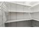 Walk-in pantry with wire and solid shelves for ample storage space at 9240 E Girard Ave # 1, Denver, CO 80231