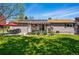 Backyard with solar panels, a pergola-covered patio, and well-maintained landscaping offering a serene outdoor space at 6655 S Elm Cir, Centennial, CO 80121