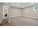 Neutral-toned basement featuring carpet and bright recessed lighting at 6655 S Elm Cir, Centennial, CO 80121