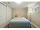 Bedroom featuring soft light, natural lighting, closet, and neutral carpet at 6655 S Elm Cir, Centennial, CO 80121
