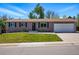 Charming single story home with a manicured lawn and an attached two-car garage at 6655 S Elm Cir, Centennial, CO 80121