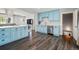 Contemporary kitchen boasts a stylish island and stainless steel appliances with easy access to the basement at 6655 S Elm Cir, Centennial, CO 80121