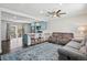 Open-concept living area seamlessly connects to the kitchen, complete with counter seating at 6655 S Elm Cir, Centennial, CO 80121