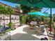 A beautiful outdoor patio has mature landscaping, a fire pit, and is perfect for entertaining at 1594 S Locust St, Denver, CO 80224