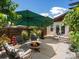 Relaxing patio area with outdoor furniture and shade umbrellas, perfect for outdoor entertaining at 1594 S Locust St, Denver, CO 80224