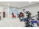 Basement with a world map, exercise equipment, and a functional office area at 1594 S Locust St, Denver, CO 80224