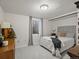 Bright bedroom with neutral decor, plush carpet, and a window at 1594 S Locust St, Denver, CO 80224