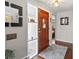 Entryway with decorative glass, wood door, and hardwood floors at 1594 S Locust St, Denver, CO 80224
