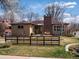 Charming home with a brick chimney and fenced front yard at 1594 S Locust St, Denver, CO 80224