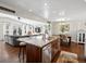 Open-concept kitchen island flows into dining and living areas, perfect for entertaining and Gathering gatherings at 1594 S Locust St, Denver, CO 80224