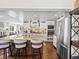 Spacious kitchen island features bar stool seating and stainless steel appliances, enhancing culinary experience at 1594 S Locust St, Denver, CO 80224