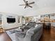 Spacious living room with an open layout to the kitchen and large windows offering lots of natural light at 1594 S Locust St, Denver, CO 80224