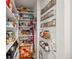 Well-organized pantry shelves and spice racks maximize storage and streamline meal preparation at 1594 S Locust St, Denver, CO 80224