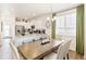 Kitchen and dining area with modern appliances and farmhouse-style table at 22293 E 6Th Pl, Aurora, CO 80018