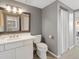 Bathroom features white vanity with a framed mirror, tile floors and modern fixtures at 345 Fillmore St # 407, Denver, CO 80206