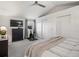 Well-lit bedroom with ceiling fan, comfortable bed, and a dedicated workout area with exercise bike at 345 Fillmore St # 407, Denver, CO 80206