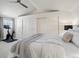 Bright bedroom featuring plush carpeting, a ceiling fan, ample closet space, and a comfortable bed with modern decor at 345 Fillmore St # 407, Denver, CO 80206