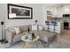 Living room featuring a comfortable sofa, stylish decor, an open concept design and a stylish kitchen at 345 Fillmore St # 407, Denver, CO 80206