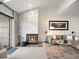 Living room featuring a marble fireplace, stylish seating, and a patio door at 345 Fillmore St # 407, Denver, CO 80206