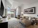 Bright living room with a marble fireplace, stylish seating and an expansive view of the outdoors at 345 Fillmore St # 407, Denver, CO 80206