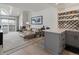 Living room featuring a marble fireplace, stylish seating, an open concept design and a stylish kitchen at 345 Fillmore St # 407, Denver, CO 80206