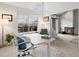 Bright office space with a modern desk, large window, fireplace and comfortable seating area at 345 Fillmore St # 407, Denver, CO 80206