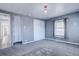 Bedroom with gray walls, carpet, and built-in closet at 939 Knox Ct, Denver, CO 80204