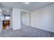 Bedroom with mirrored closet and view of kitchen at 939 Knox Ct, Denver, CO 80204