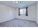 Bright bedroom with neutral walls and carpet at 939 Knox Ct, Denver, CO 80204