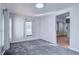 Bright living room with gray carpet and an open floor plan at 939 Knox Ct, Denver, CO 80204